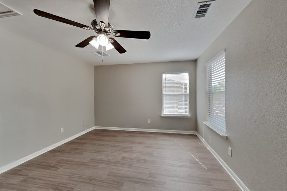 6423 Lily Hollow Court Spring, TX 77379 - Photo 16 of 20 wooden floor in an empty room with a window