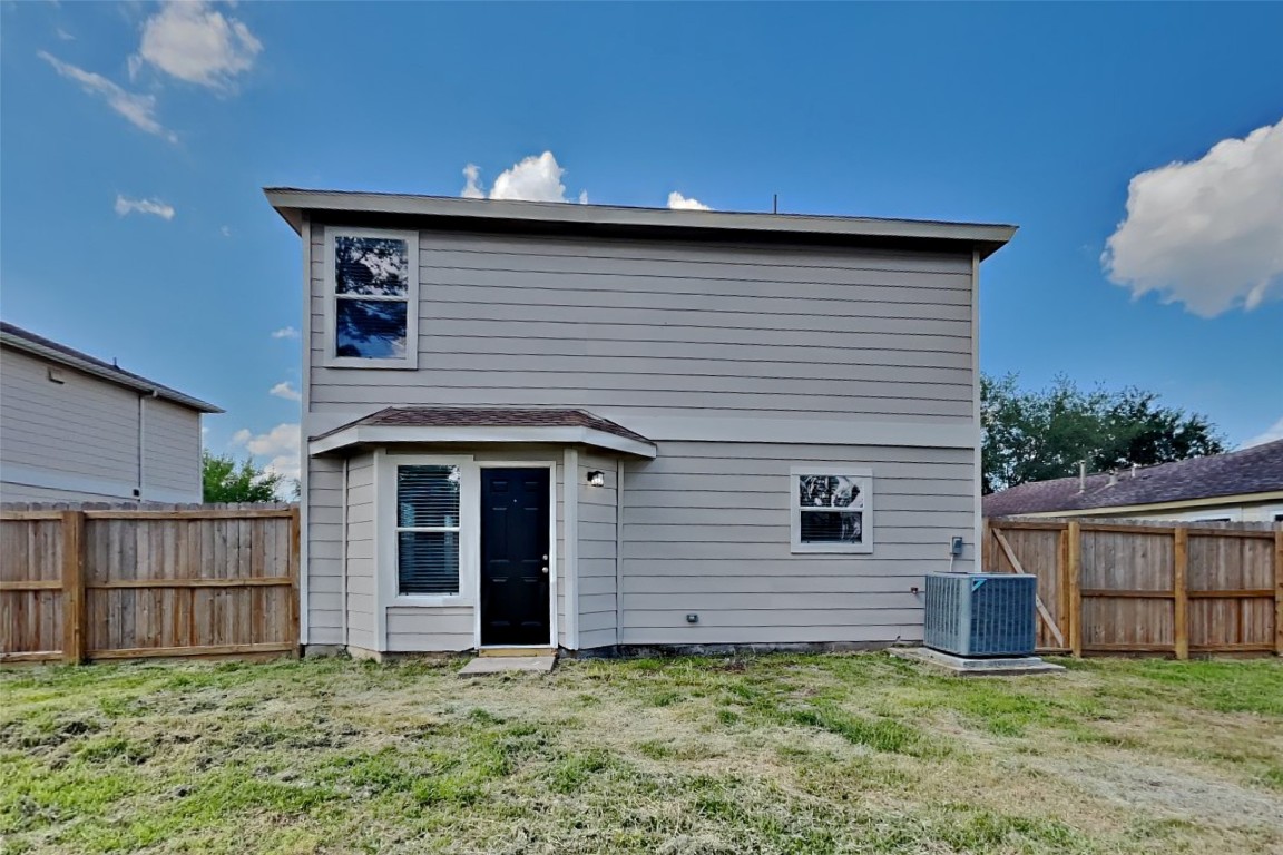 6423 Lily Hollow Court Spring, TX 77379 - Photo 18 of 20 a house with a yard