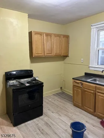 a view of room with window and hardwood