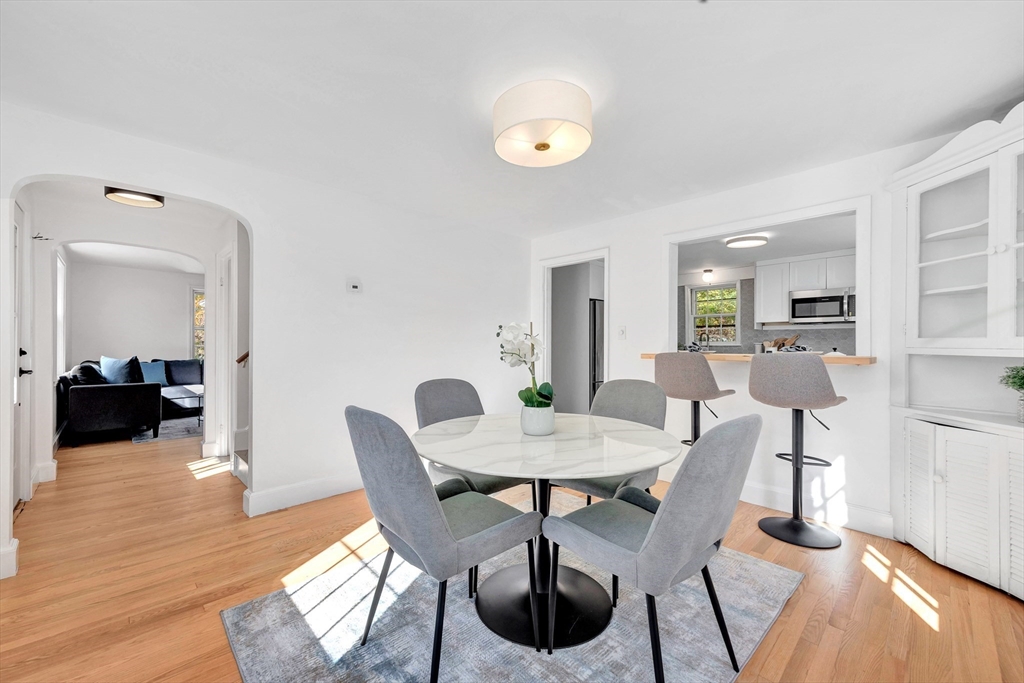 139 High Street Winchester, MA 01890 - Photo 12 of 24 a view of a dining room with furniture and wooden floor