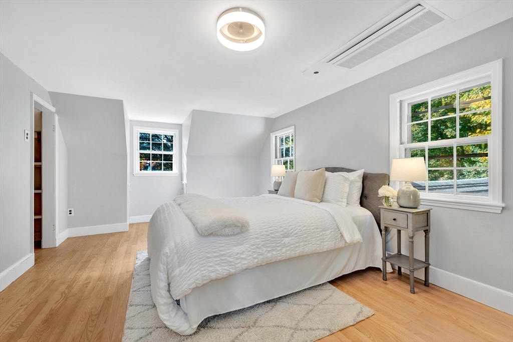 139 High Street Winchester, MA 01890 - Photo 15 of 24 a bedroom with a bed and a window