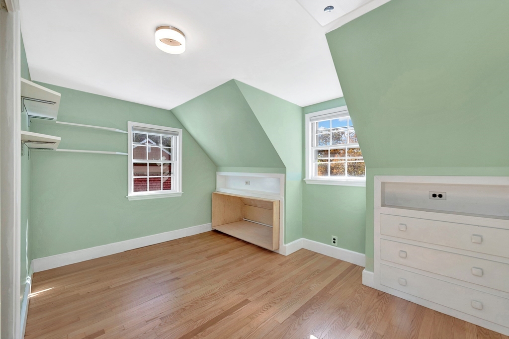 139 High Street Winchester, MA 01890 - Photo 18 of 24 a room with a window and wooden floor