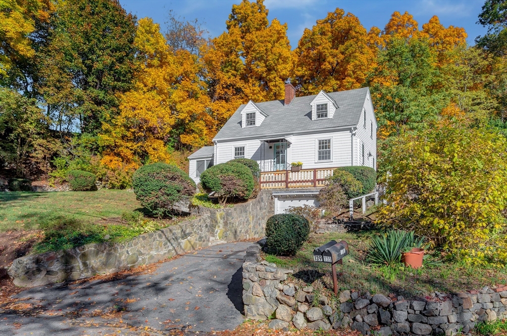 139 High Street Winchester, MA 01890 - Photo 20 of 24 a front view of a house with a yard