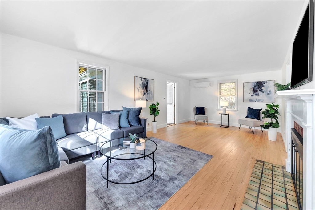 139 High Street Winchester, MA 01890 - Photo 3 of 24 a living room with furniture and a flat screen tv