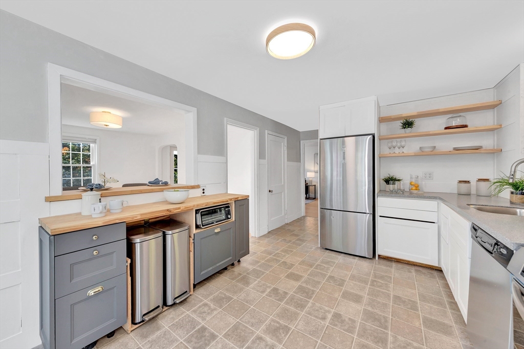 139 High Street Winchester, MA 01890 - Photo 8 of 24 a kitchen with a sink stove and refrigerator