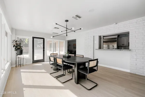 a view of a livingroom with furniture and an entryway