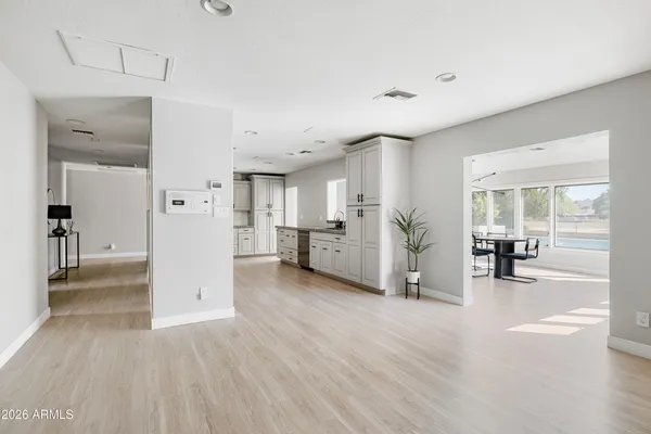 a large kitchen with a stove and refrigerator