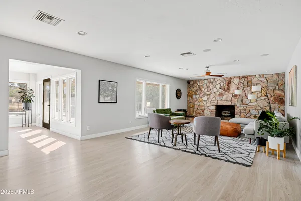 a living room with furniture and a fireplace