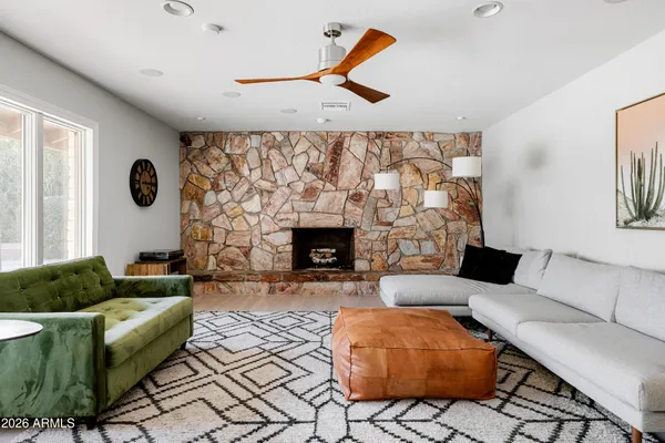 a living room with furniture and a fireplace
