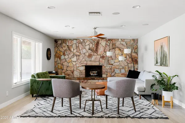 a living room with furniture and a fireplace