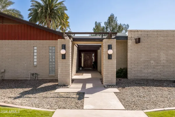 a view of pool with large trees and a big yard