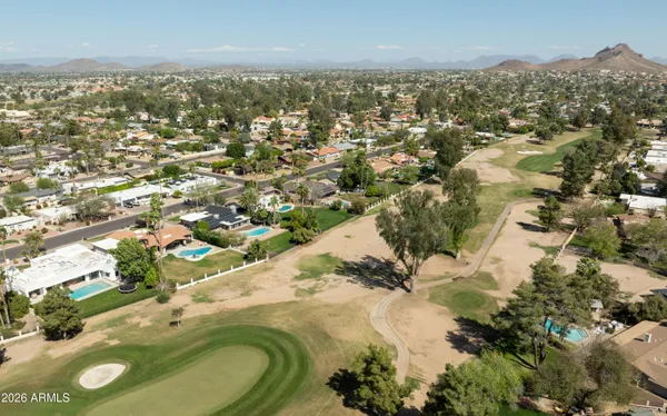 an aerial view of residential houses with outdoor space