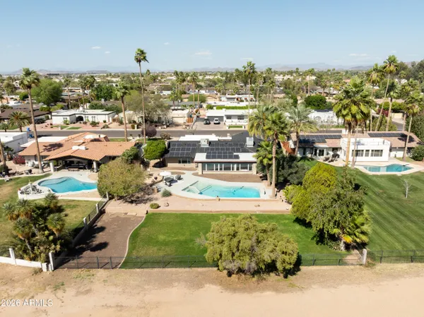 a view of a house with a yard and garage