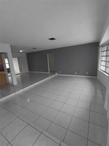 an empty room with glass door