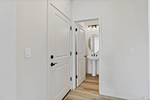 a view of a bathroom from a hallway