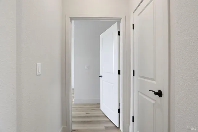a view of a bathroom from the hallway