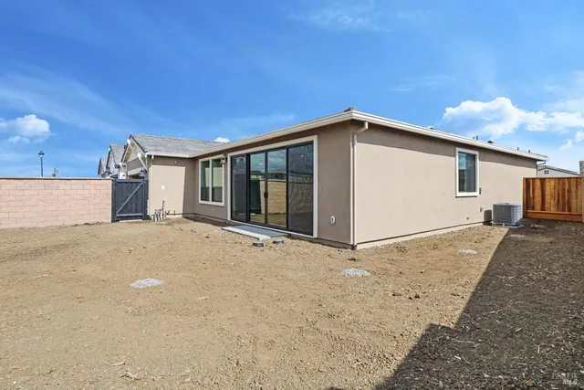 a view of a house with backyard