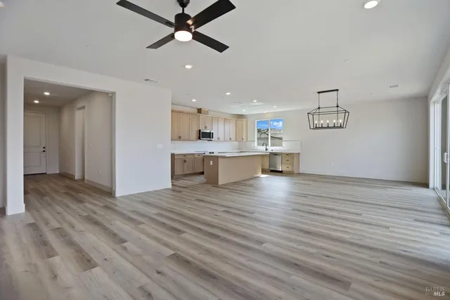 a view of a kitchen with a dishwasher and a window
