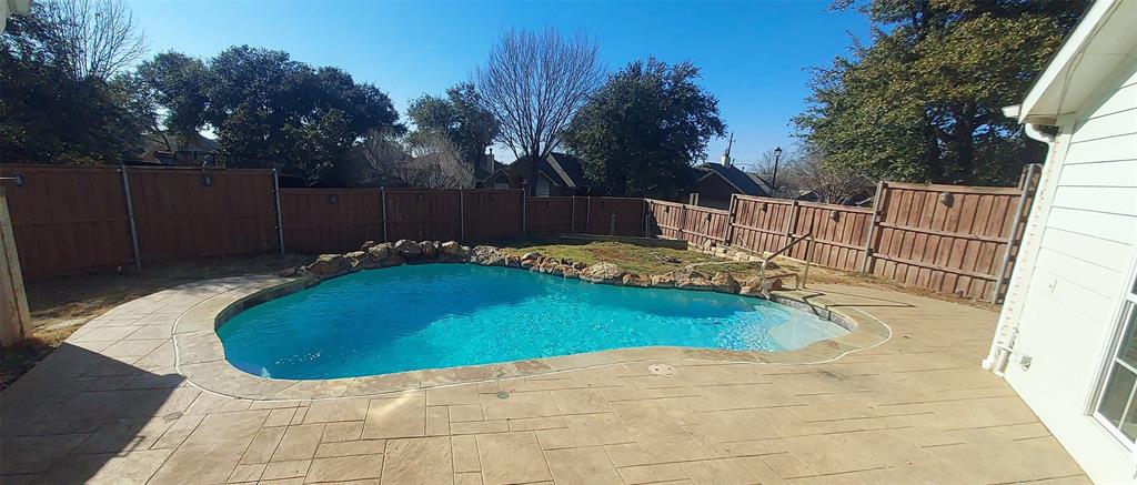 4102 Midrose Trail Dallas, TX 75287 - Photo 2 of 16 a view of a swimming pool with a patio