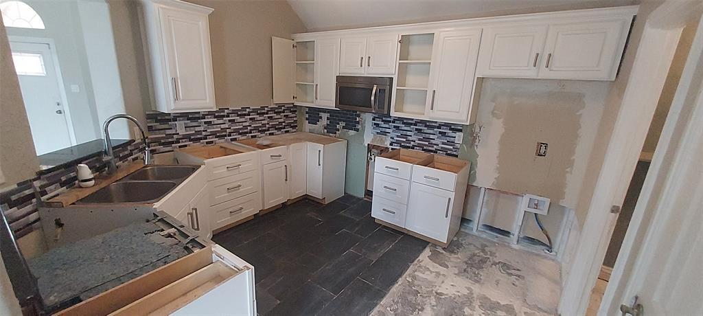 4102 Midrose Trail Dallas, TX 75287 - Photo 7 of 16 a kitchen with a sink stove and refrigerator