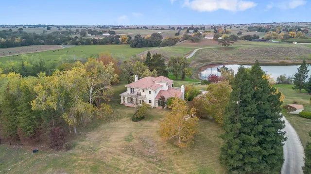 an aerial view of a houses with outdoor space