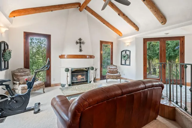 a kitchen with stainless steel appliances kitchen island granite countertop a stove a sink and a refrigerator