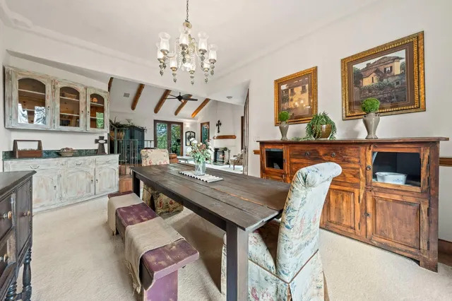a bedroom with bed and a chandelier