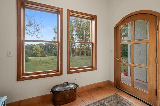 a bedroom with a bed and ceiling fan