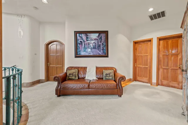 a view of a field with large trees