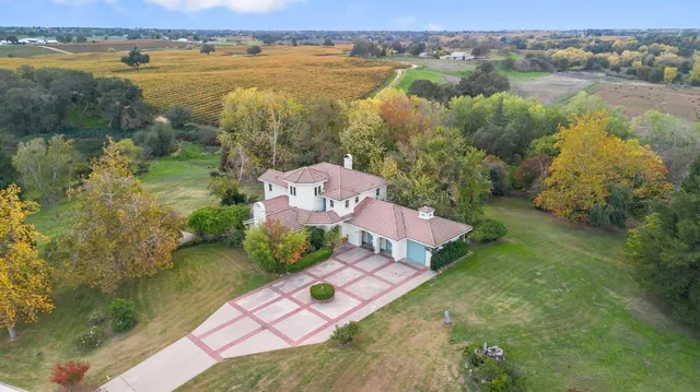 an aerial view of lake residential house with outdoor space and trees