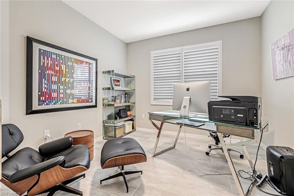 1603 Santiago Circle Naples, FL 34113 - Photo 13 of 46 a workspace with furniture and a window