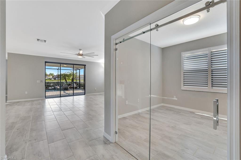 1603 Santiago Circle Naples, FL 34113 - Photo 14 of 46 a view of an empty room and window
