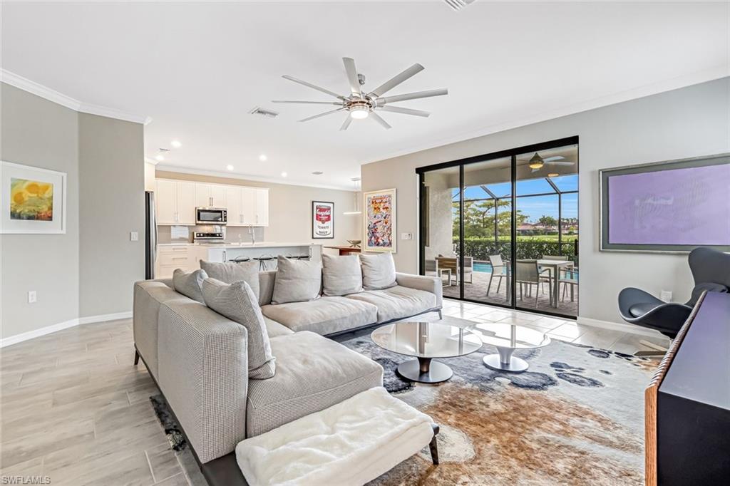 1603 Santiago Circle Naples, FL 34113 - Photo 46 of 46 a living room with furniture and a large window