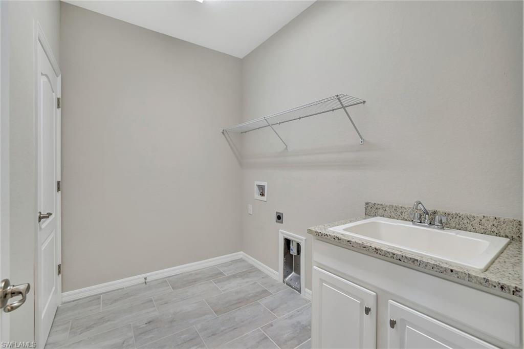 1603 Santiago Circle Naples, FL 34113 - Photo 23 of 46 a bathroom with a sink and a mirror