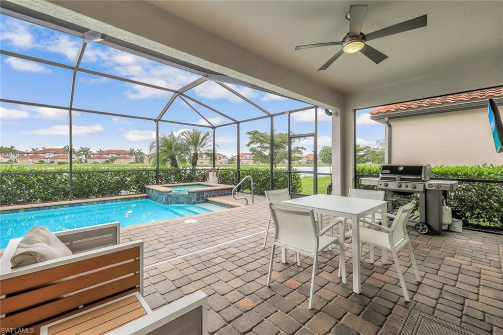 1603 Santiago Circle Naples, FL 34113 - Photo 24 of 46 a view of swimming pool with seating space