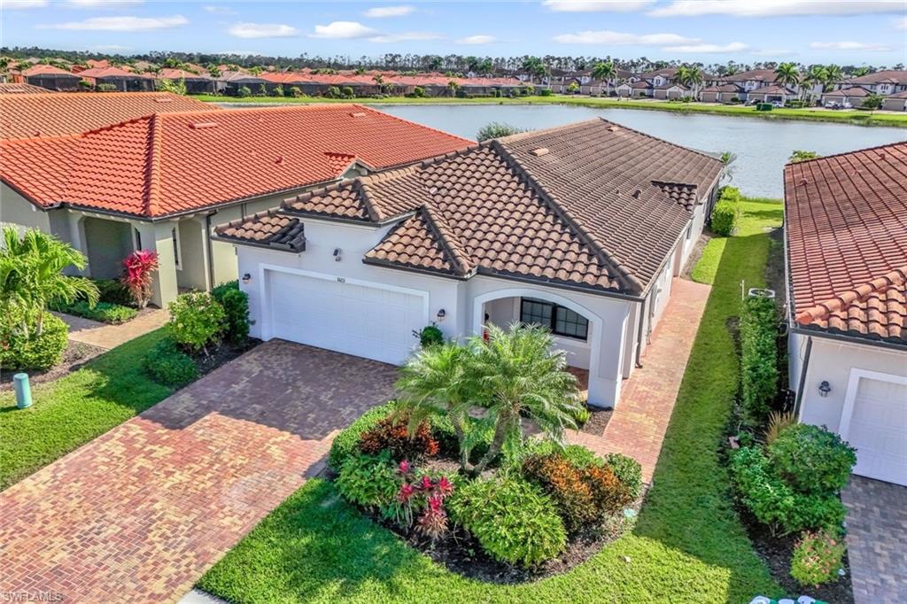 1603 Santiago Circle Naples, FL 34113 - Photo 35 of 46 an aerial view of a house with outdoor space and lake view in back