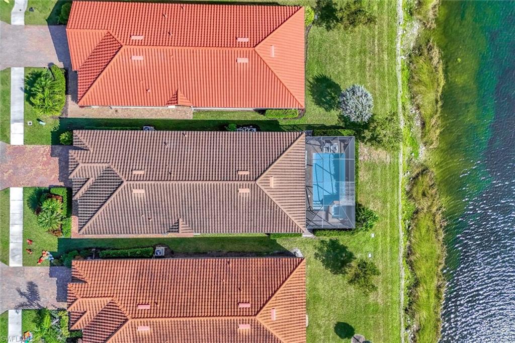 1603 Santiago Circle Naples, FL 34113 - Photo 36 of 46 a aerial view of a house with a yard and potted plants