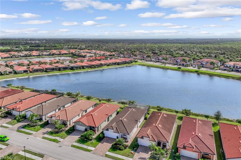 1603 Santiago Circle Naples, FL 34113 - Photo 37 of 46 an aerial view of residential houses with outdoor space and lake view