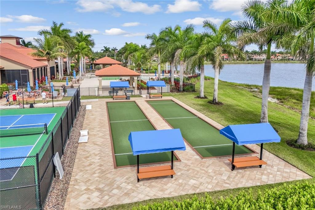 1603 Santiago Circle Naples, FL 34113 - Photo 45 of 46 a swimming pool with outdoor seating and yard