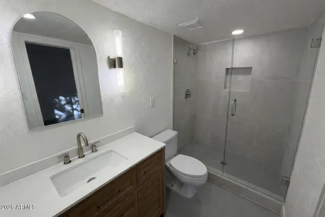 an empty room with a ceiling fan and a ceiling fan