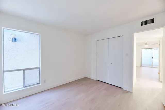 a view of an empty room with a window