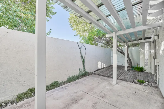 a view of a swimming pool with a table and chairs