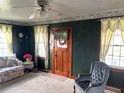 a living room with furniture and a window