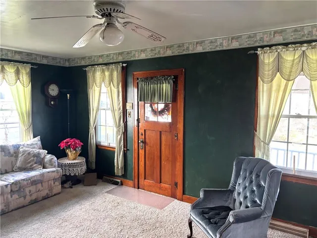 a living room with furniture and a window