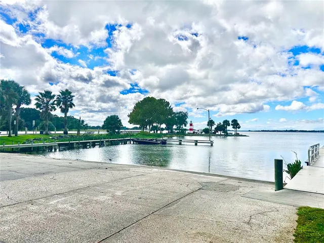 a view of outdoor space with playground and green space