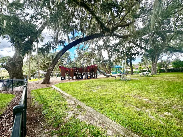 a patio with a yard table and chairs