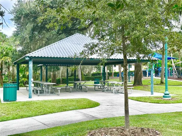 a view of a backyard with plants and a patio