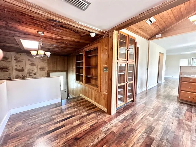a view of a porch with furniture and a yard