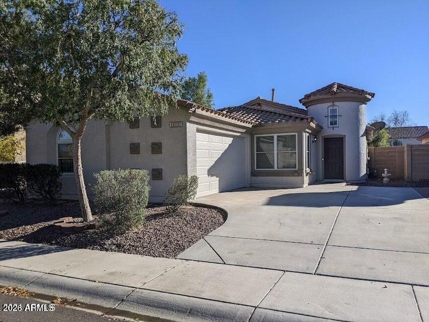 18237 West Bridger Street Surprise, AZ 85388 - Photo 4 of 4 a front view of a house with garden