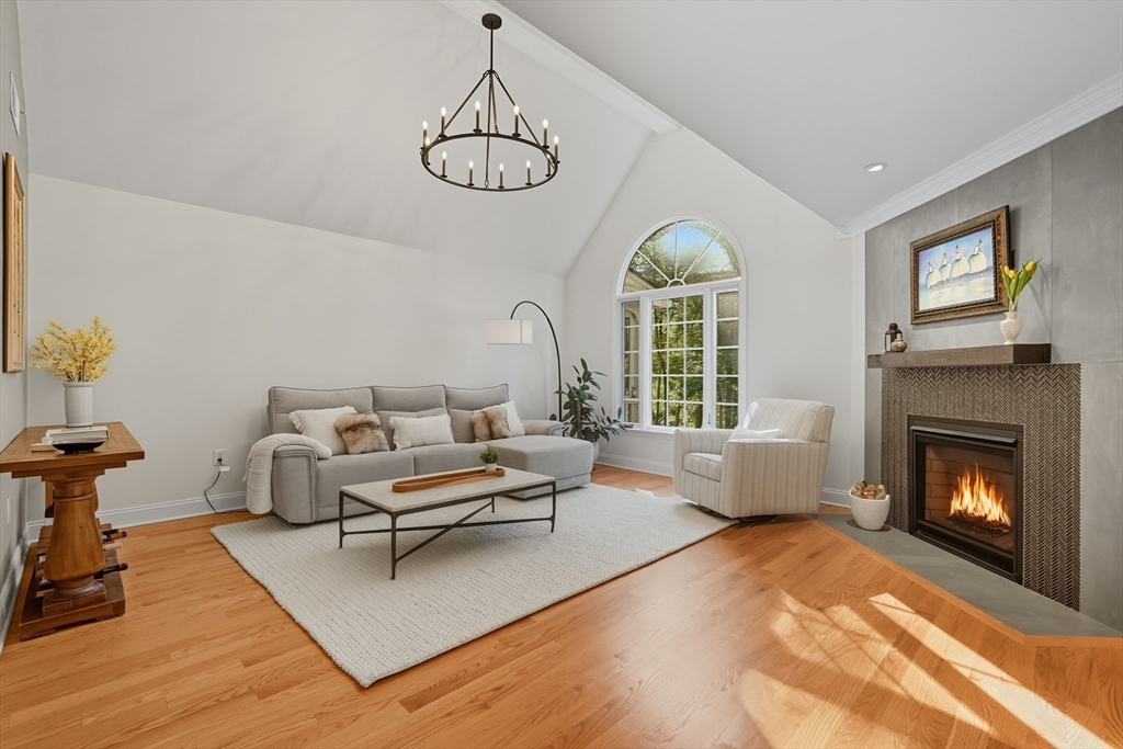 32 Windpath East, Unit 32 West Springfield, MA 01089 - Photo 12 of 40 a living room with furniture chandelier and a fireplace